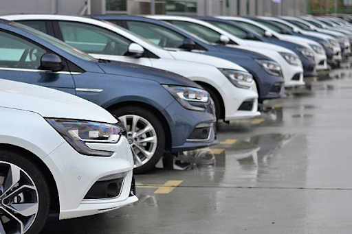 Image of rental cars packed in line